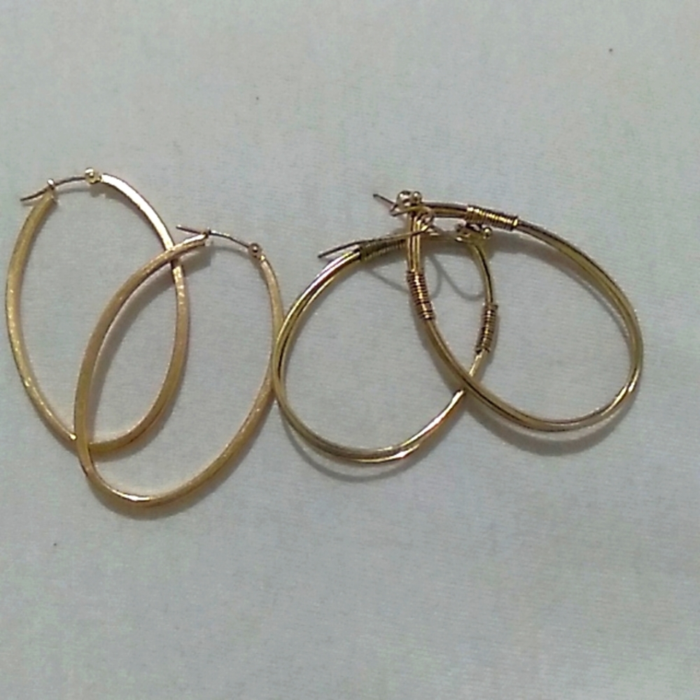Two pairs of gold toned oval earrings